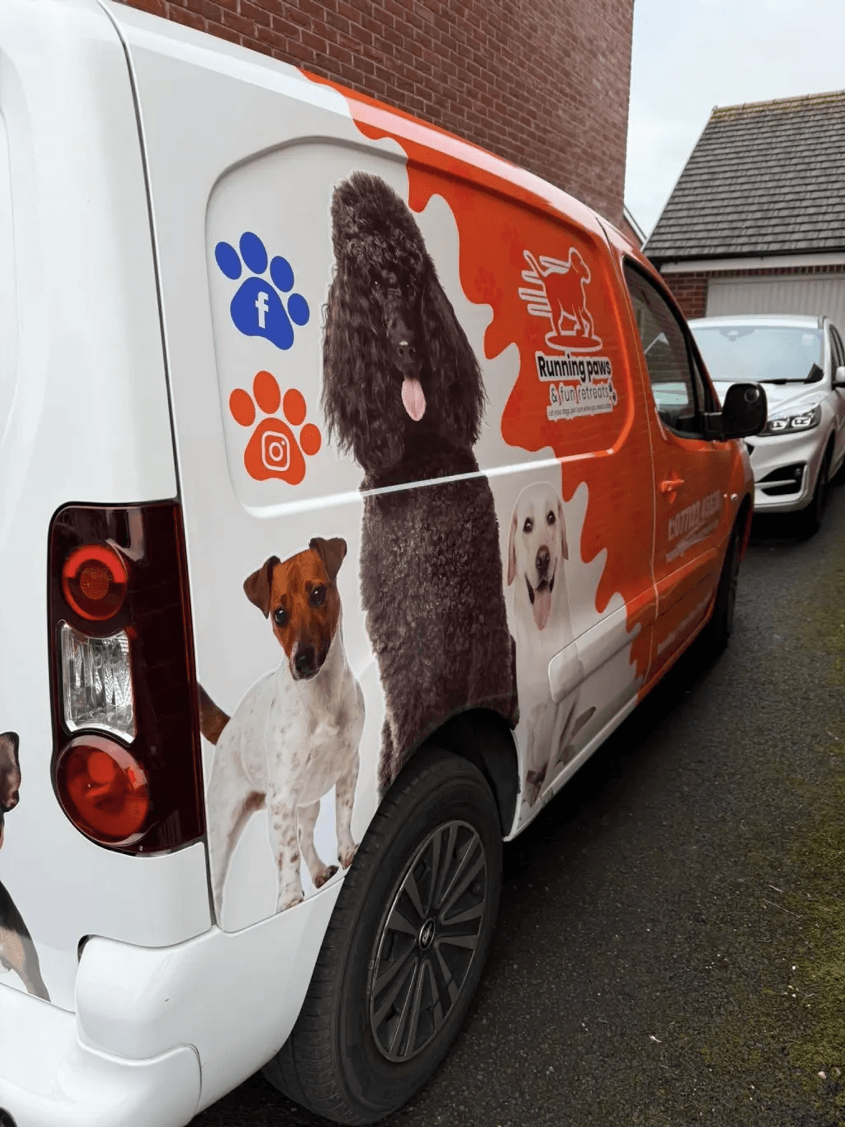 The side of the Running Paws & Fun Retreats van